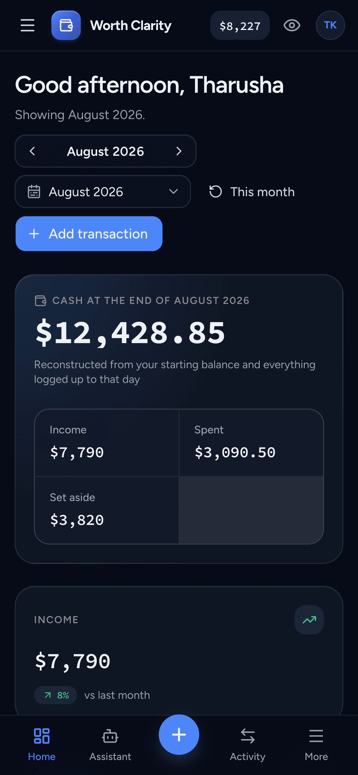 The Worth Clarity dashboard on a phone in dark mode, showing cash at the end of the month and the income tile